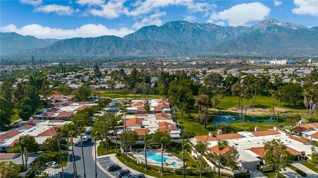 birds eye view of property with a mountain view