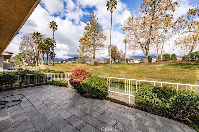 view of patio / terrace featuring a mountain view