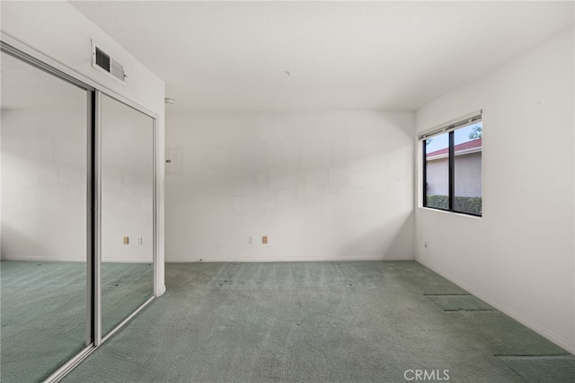 unfurnished bedroom featuring a closet and carpet