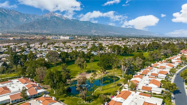 birds eye view of property with a mountain view