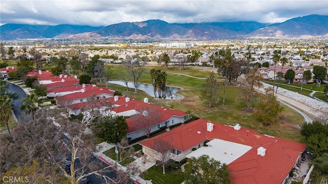 birds eye view of property featuring a water and mountain view