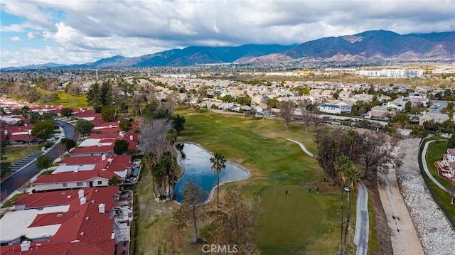 drone / aerial view with a water and mountain view