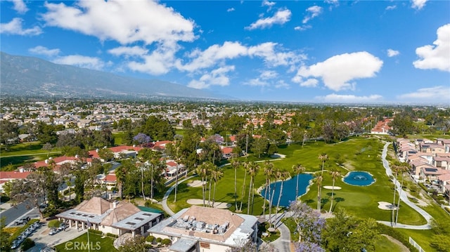 birds eye view of property featuring a water and mountain view