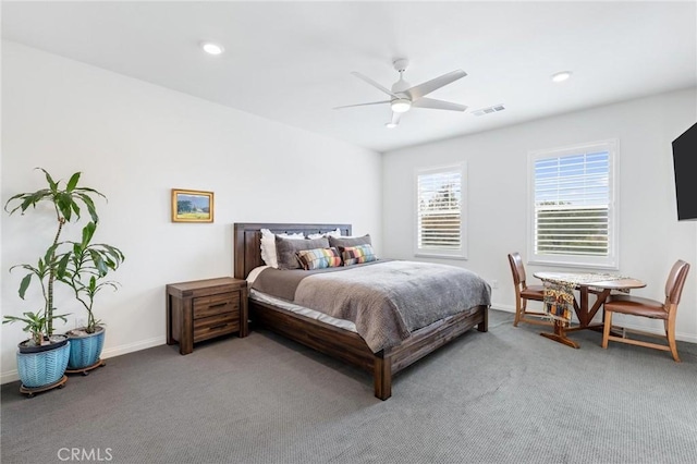 bedroom featuring ceiling fan and carpet