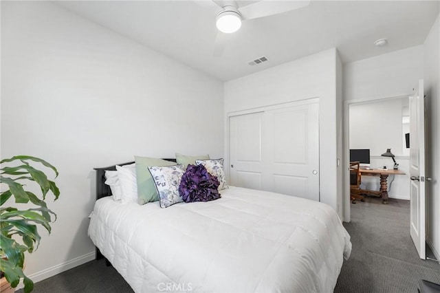 carpeted bedroom with ceiling fan and a closet