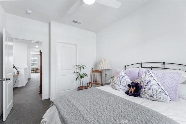 bedroom featuring ceiling fan and dark colored carpet