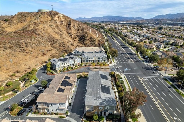 birds eye view of property with a mountain view