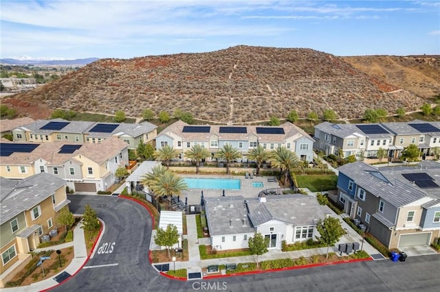 birds eye view of property with a mountain view