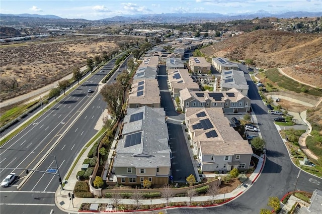 birds eye view of property with a mountain view