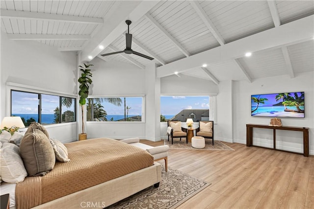 bedroom featuring a water view, high vaulted ceiling, beamed ceiling, ceiling fan, and light hardwood / wood-style floors