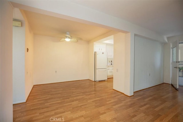 465 Avenida Sevilla Unit C, Laguna Woods, CA 92637 - spare room featuring light wood finished floors, ceiling fan, and baseboards