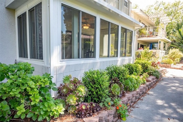 465 Avenida Sevilla Unit C, Laguna Woods, CA 92637 - view of side of home with a sunroom and a balcony