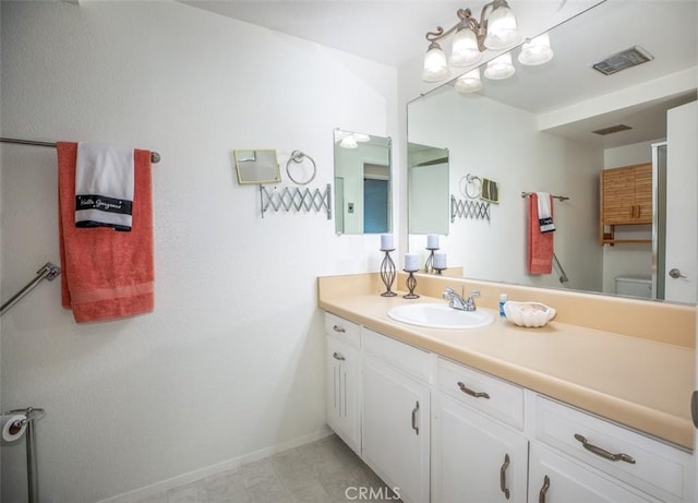 465 Avenida Sevilla Unit C, Laguna Woods, CA 92637 - bathroom with baseboards, vanity, and toilet