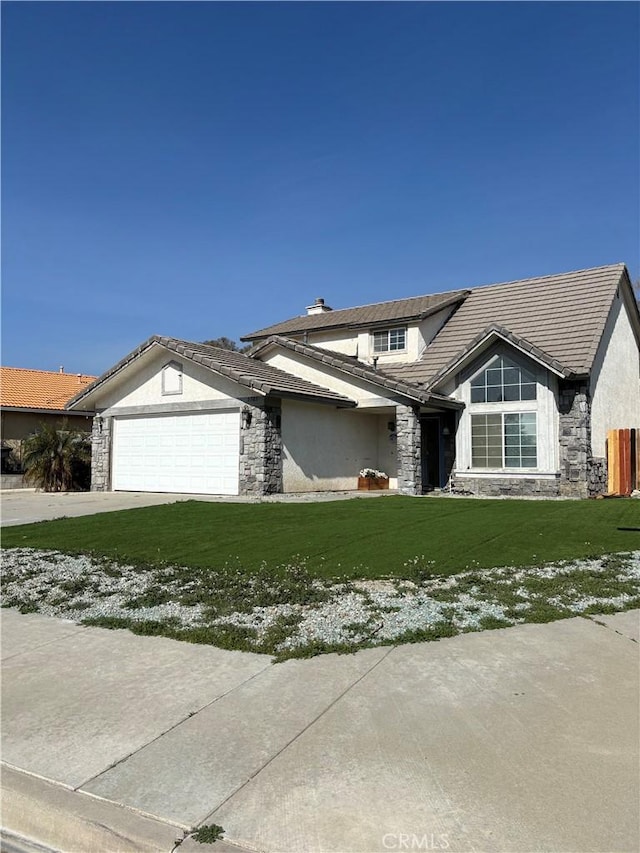 view of front facade featuring a garage and a front yard