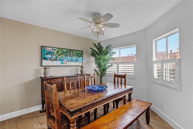 dining space featuring ceiling fan and light hardwood / wood-style flooring