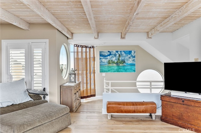 sitting room featuring light wood-type flooring, wooden ceiling, and beam ceiling