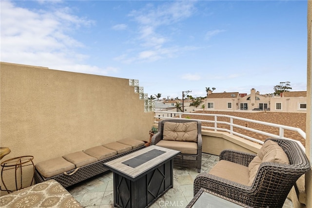 view of patio with a balcony and an outdoor hangout area