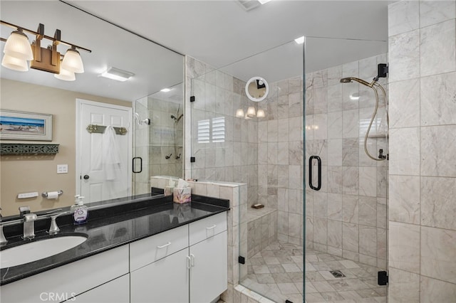 bathroom with an enclosed shower and vanity