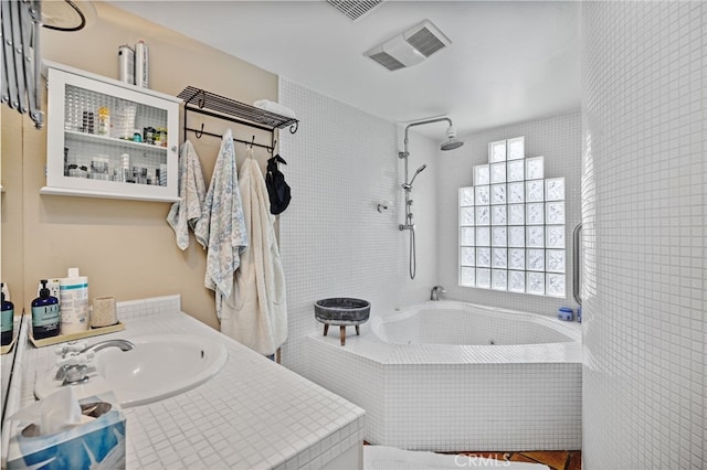 bathroom featuring vanity and separate shower and tub