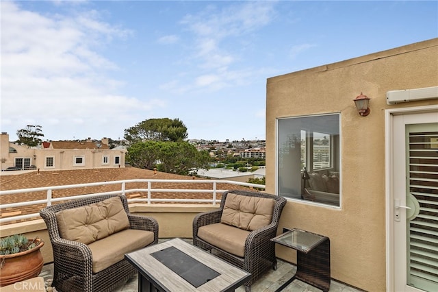 view of patio featuring a balcony