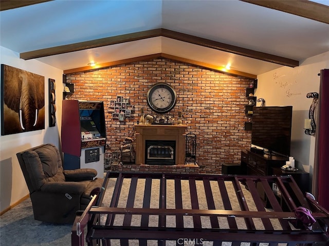 living room with carpet floors, a fireplace, and lofted ceiling with beams