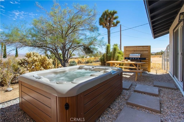 exterior space featuring a hot tub