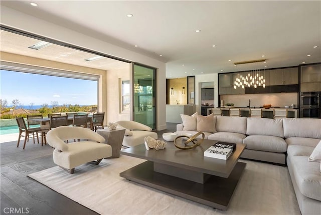 living room featuring sink and light hardwood / wood-style flooring