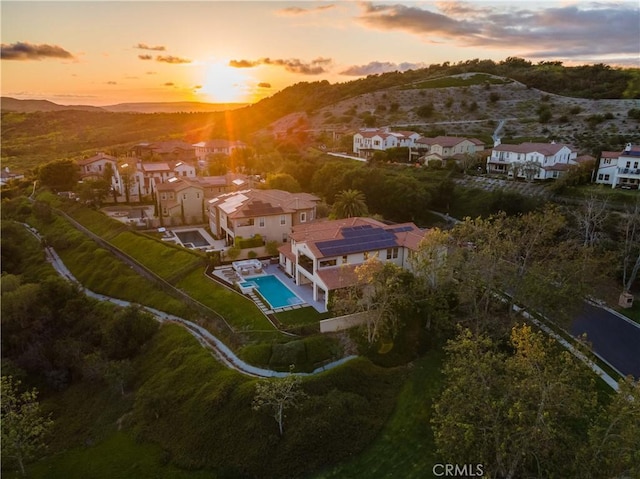 aerial view at dusk with a mountain view