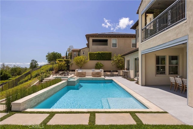 view of pool featuring a patio and an outdoor hangout area