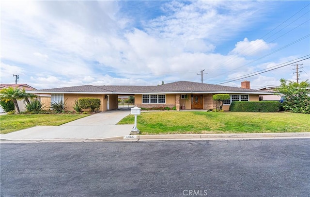 ranch-style home with a front lawn