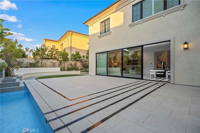 rear view of house featuring a patio