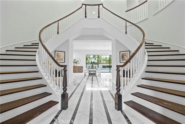 entryway with a towering ceiling