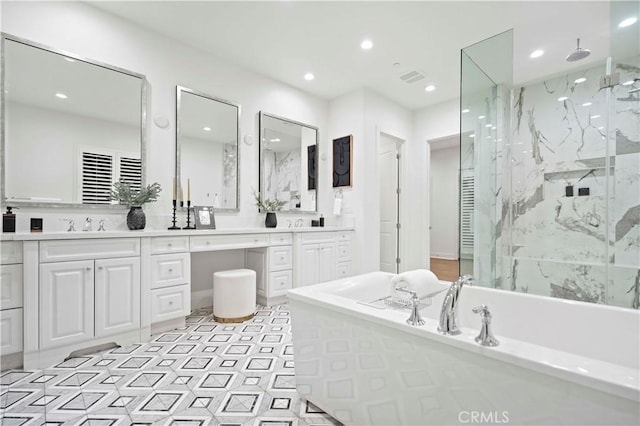 bathroom with vanity and independent shower and bath