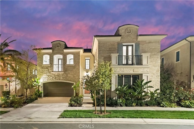 view of front of property with a garage and a balcony