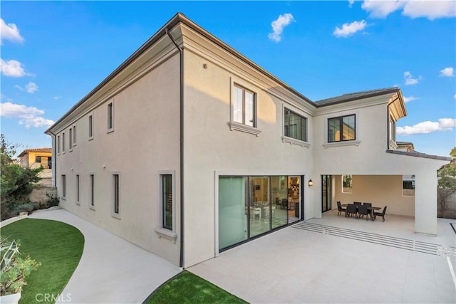 rear view of property with a patio area