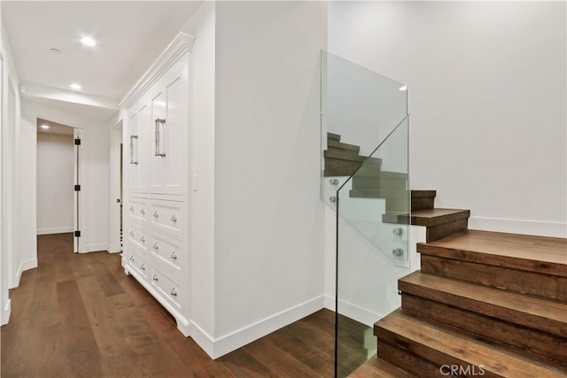 stairs with recessed lighting, baseboards, and wood finished floors