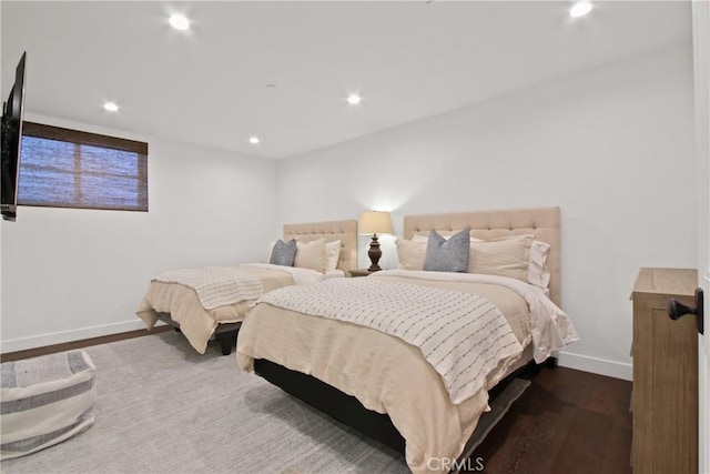 bedroom featuring recessed lighting, dark wood-style floors, and baseboards