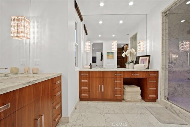 full bath featuring a marble finish shower, two vanities, recessed lighting, marble finish floor, and a sink