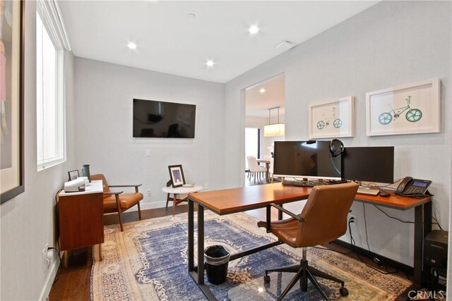 office space with recessed lighting, baseboards, and wood finished floors