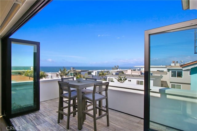 balcony featuring a water view