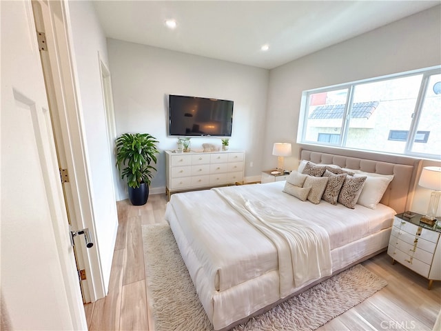 bedroom with light hardwood / wood-style floors