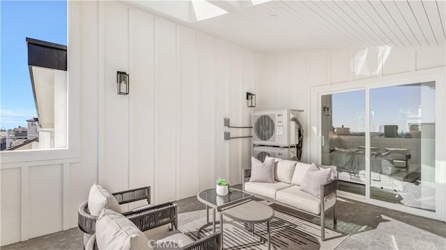 living room featuring a skylight, concrete flooring, wooden ceiling, and stacked washing maching and dryer