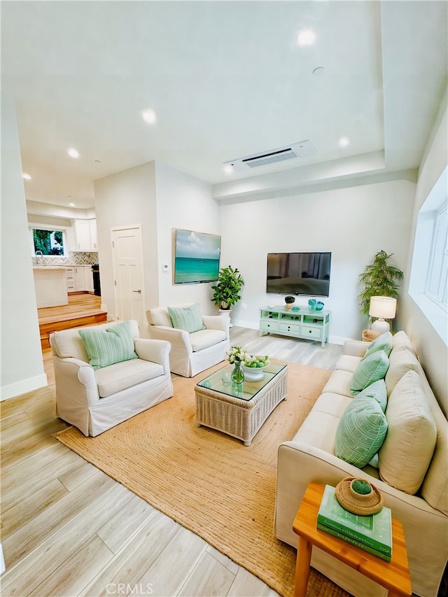 living room with light hardwood / wood-style flooring