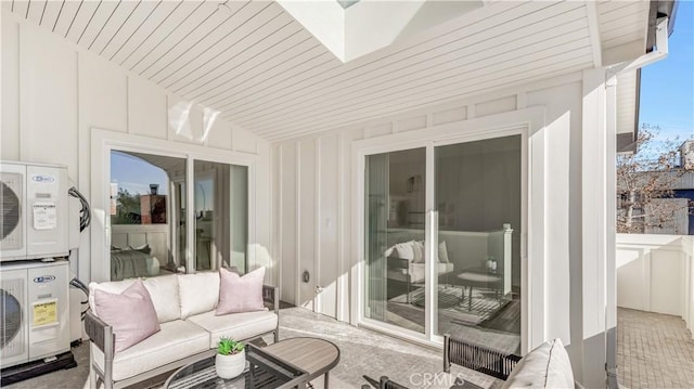 sunroom / solarium featuring wood ceiling, vaulted ceiling, and ac unit