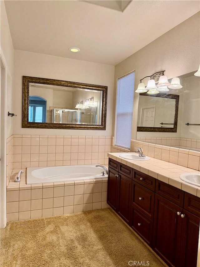 bathroom featuring vanity and plus walk in shower