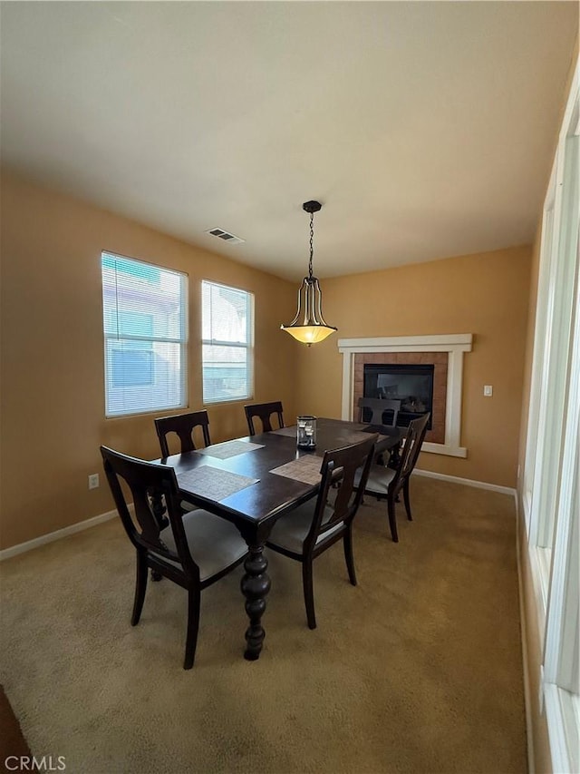 dining room featuring light colored carpet