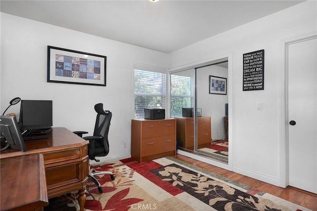 office area with light wood-type flooring