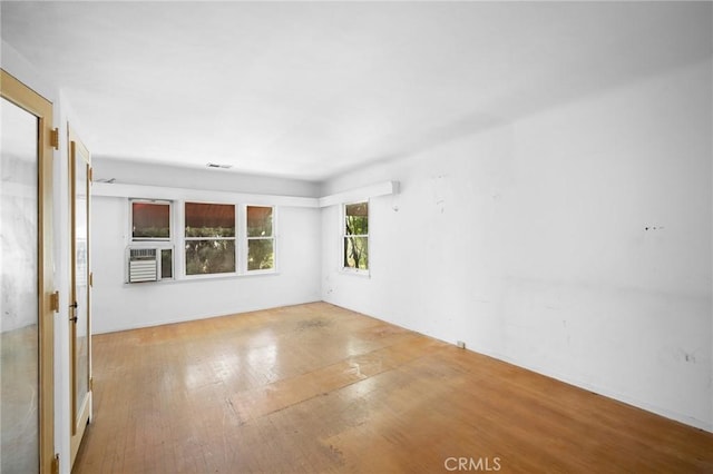 empty room featuring hardwood / wood-style flooring