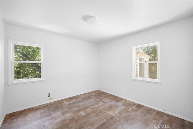 unfurnished room featuring light hardwood / wood-style flooring