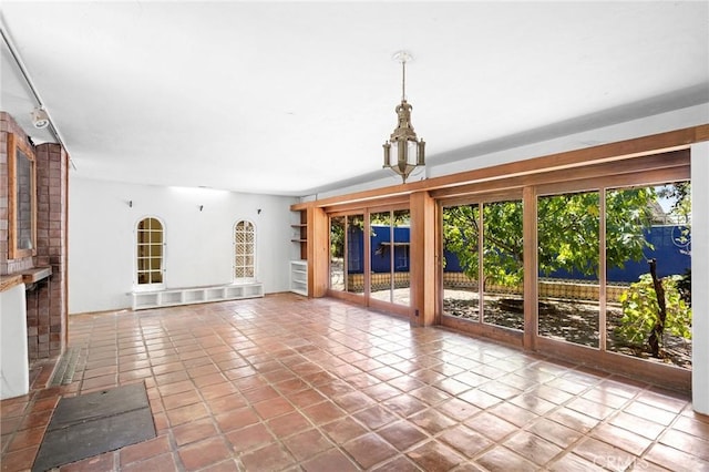 unfurnished living room with tile patterned floors